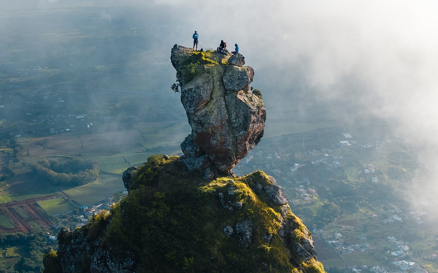 Climbers on the summit boulder of Pieter Both